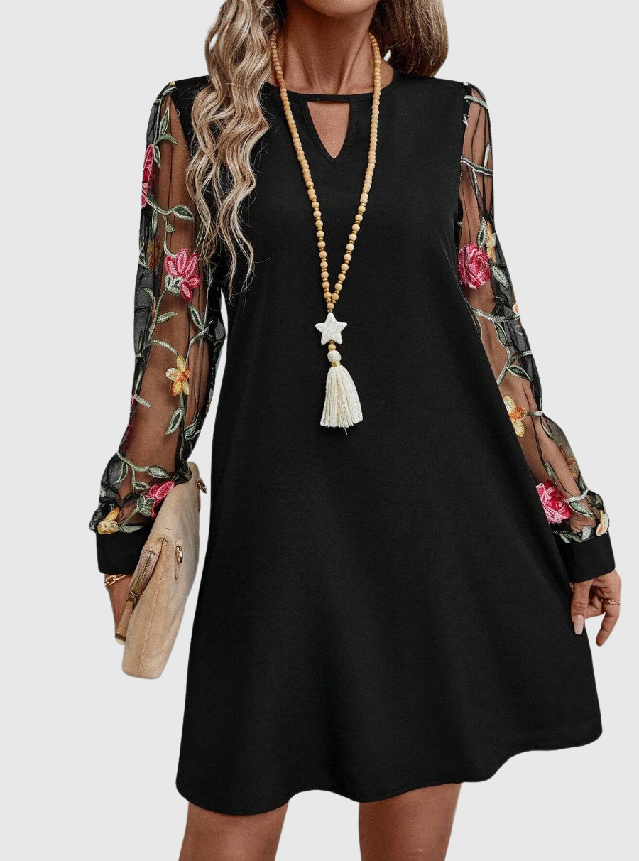 Jolanta | Elegancka sukienka z dekoltem w kształcie V i wyrazistymi rękawami